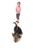 Little girl walking yorkshire terrier pup on a lead