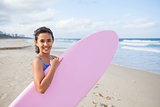 Happy young girl with surfboard