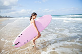Young girl with surfboard