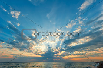 beautiful clouds with the setting sun over the sea