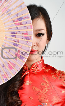 pretty women with Chinese traditional dress Cheongsam and hole C