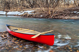 red canoe on a river