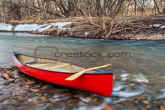 red canoe on a river