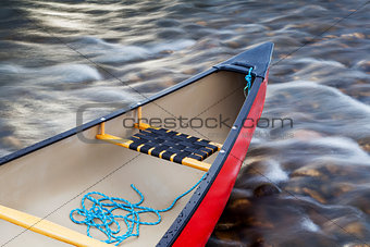 red canoe stern with a rope