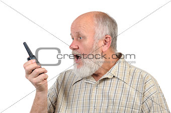 senior bald man talking using walkie-talkie