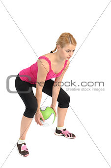 Young lady doing medicine ball workout