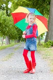 little girl with umbrella in alley