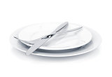 Silverware or flatware set of fork and knife over plates