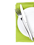 Silverware or flatware set of fork and knife over plate