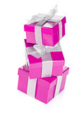 Three purple gift boxes with silver ribbon and bow