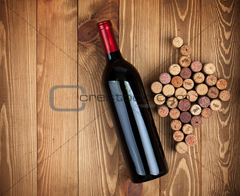 Red wine bottle and grape shaped corks