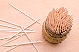 Wooden toothpicks from above on a cutboard