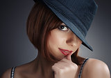 women with black hat and red lips
