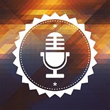 Microphone Icon on Retro Triangle Background.