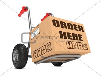 Order Here - Cardboard Box on Hand Truck.