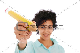 hispanic business woman holding huge yellow pencil