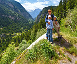 Family in summer Alps mountain (Switzerland).