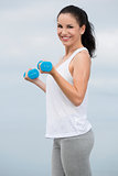 Woman doing exercises with weights 