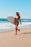 Surfer girl at the beach