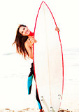 Surfer girl with her surfboard
