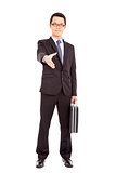 success businessman holding briefcase and handshake