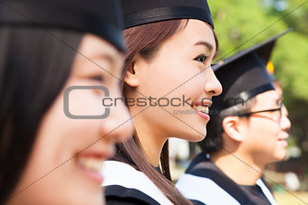 a group cheerful college graduates at graduation