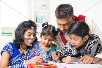 Indian family painting picture at home