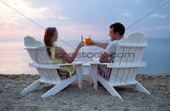 Romantic couple toasting the sunset