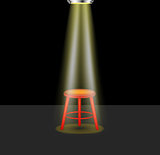 Light shines on empty stool on stage
