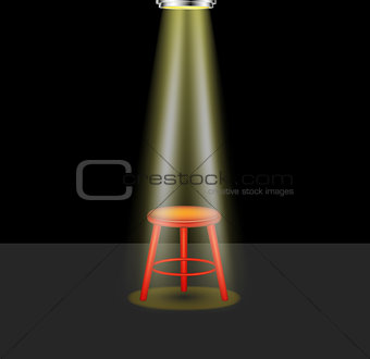 Light shines on empty stool on stage