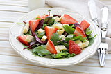 gourmet salad with fresh strawberries and cheese