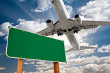 Blank Green Road Sign and Airplane Above