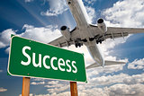 Success Green Road Sign and Airplane Above