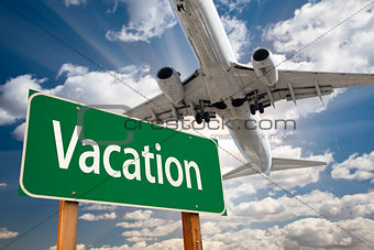 Vacation Green Road Sign and Airplane Above