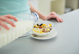 Closeup on young woman making healthy breakfast