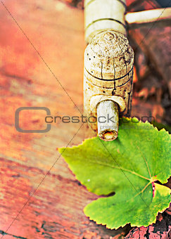  wine cask  and grapes leaf, retro colors, paper grain