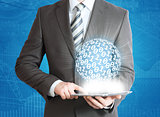 Man holding tablet pc and digital sphere in hand