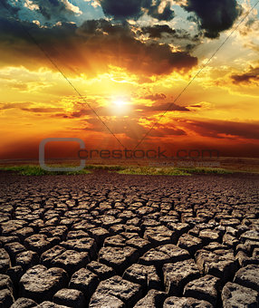 dramatic sunset over drought land