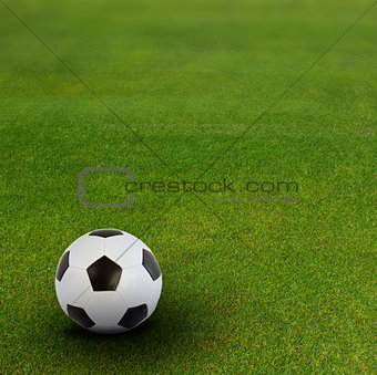 soccer ball on green football field