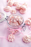 Pink meringues in a glass jar 