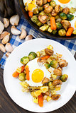 Baked eggs with vegetables and mushrooms