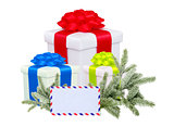 christmas gifts with post card and branch firtree isolated on wh