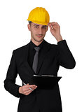 Man with Hard Hat Holding Clipboard