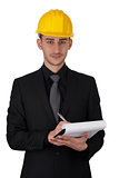 Man with Hard Hat Holding Clipboard