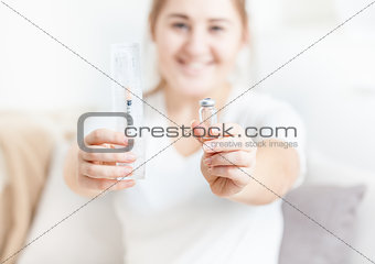 Woman holding syringe