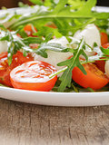 salad from arugula tomatos and baby mozzarella