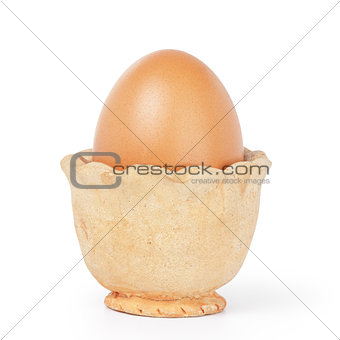 brown egg in handmade holder