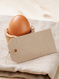 brown egg in handmade holder