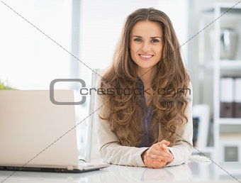Portrait of happy business woman in office