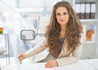 Portrait of business woman sitting in office